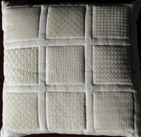Even a pillowcase (3-1997), decorated with different Satin stitch patterns and, after embroidering, underlaid with a fleece and quilted, evolves into a beautiful effect.